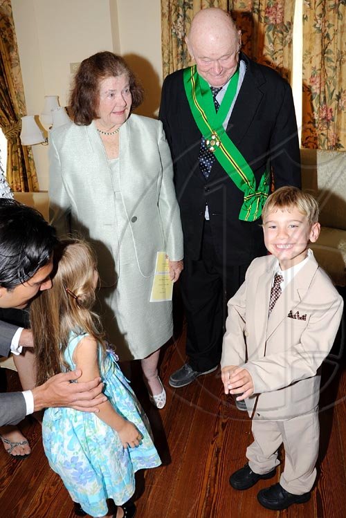 Rudolph Brown/Chief Photographer
Desmond Blade and his Peggy chat with their great grand children after the Governor General Patrick Allen invested the Order of Jamaica on Mr. Blade during a ceremony of investiture and presentation of National Honours and Award at Kings House, St Andrew on Tuesday. May 12-2009