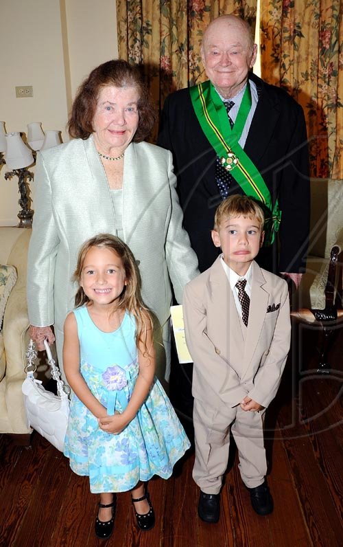 Rudolph Brown/Chief Photographer
Desmond Blade and his Peggy chat with their great grand children after the Governor General Patrick Allen invested the Order of Jamaica on Mr. Blade during a ceremony of investiture and presentation of National Honours and Award at Kings House, St Andrew on Tuesday. May 12-2009