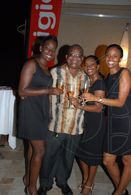 Janet Silvera Photo

Can one man be this lucky? President of the Montego Bay Chamber of Commerce and industry, Lloyd B Smith surrounds himself with Digicel beauties, from L- TShani Jaja, Jacqueline Burrell and Trisha Thompson at the Blackberry Bold 9700 launch party at Blue Beat in Montego Bay on Wednesday night.