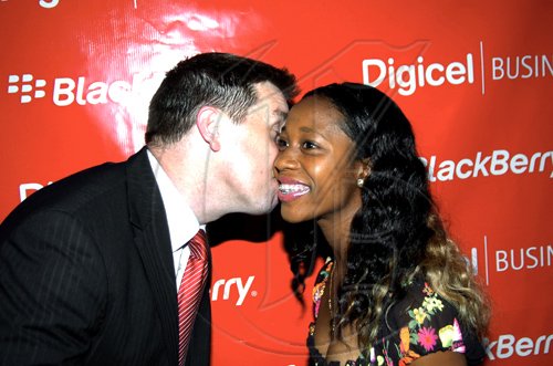 Winston Sill / Freelance Photographer
Niall Sheehy plants a kiss on the cheek of Olympian Shelly-Ann Fraser at the event.

********************************************************************Digicel launch new Blackberry Bold 9700 smart phone, held at Spanish Court Hotel, St. Lucia Avenue, New Kingston on Monday night February 8, 2010.