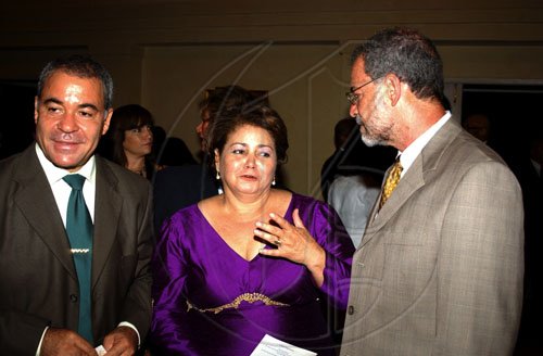 Winston Sill / Freelance Photographer
Dominican Republic Ambassador Filomena Navarro expresses her gratitude to Joseph Pereira (right), deputy principal at the UWI, Mona and Avelino Stanley, for their contribution to the Professor Juan Bosch Short Story Gala Awards held at King's House Hope Road on Tuesday June 30, 2009.