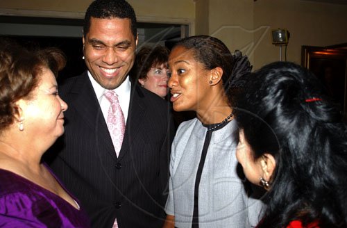 Winston Sill / Freelance Photographer
Imani Duncan (second right), JMMB group marketing manager, congratulates Ambassador Filomena Navarro (left) of the Dominican Republic on the Professor Juan Bosch Short Story competition hosted by the embassy. Looking on are Curtis McDowell of JMMB BDI America and Ecuadorian Consul Clelia Barreto de Hunter.

Gala Awards, in celebrating his centenary, held at King's House Hope Road on Tuesday June 30, 2009.