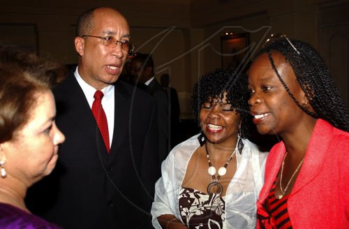 Winston Sill / Freelance Photographer
Attorney Delano Franklyn raps with (from left) Ambassador Filomena Navarro of the Dominican Republic, Cloy Corbett Jackson and Martha Corbett-Baugh at the Professor Juan Bosch Short Story Gala Awards held at King's House Hope Road on Tuesday June 30, 2009.