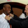 Colin Hamilton/Freelance Photographer 
The Hon. Edward Seaga adjusts the tie of Tivoli's Jermaine Allen at the Digicel Premier League and National U-21 Awards Ceremony at the Jamaica Pegasus Hotel on Tuesday June 9, 2009.