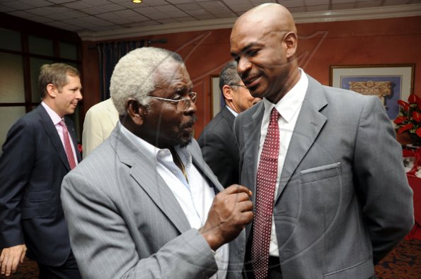 Rudolph Brown/Photographer
Pearnel Charles, (centre) Minister of Labour and Social Security chat with Roger Hinds, (right) President of the Shipping Association of Jamaica and Bruce Bowen, (left) President and CEO of Scotiabank at the Scotiabank and CCELD launches Caribbean Canada Emerging Leaders' Dialogue, CCLED Conference 2011 at Courtleigh Hotel in New Kingston on Tuesday, August 17-2010.