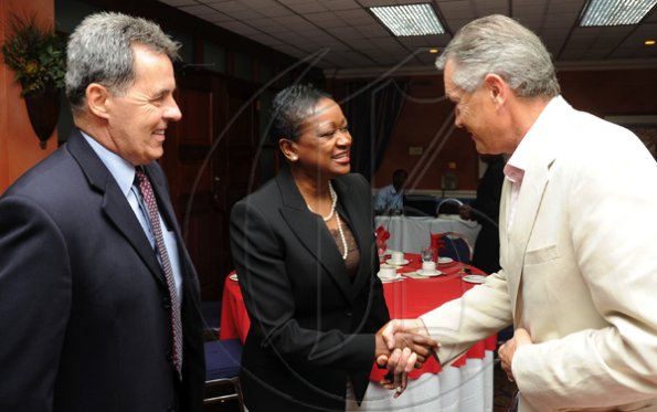 Rudolph Brown/Photographer
Minna Israel, (centre) president of RBTT Bank Jamaica Limited greets Hemi Mitic, (right) Labour Relations Consultant member CCELD Steering Committee and Stephen Hallihan, High Commissioner of Canada to Jamaica, at Scotiabank and CCELD launches Caribbean Canada Emerging Leaders' Dialogue, CCLED Conference 2011 at Courtleigh Hotel in New Kingston on Tuesday, August 17-2010.