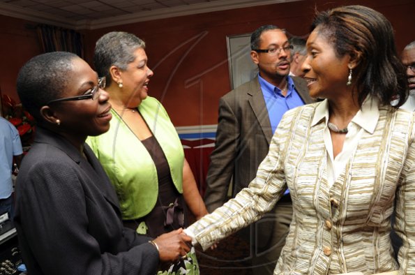 Rudolph Brown/Photographer
Joylene Griffiths Irving, (left) Director, Public and Corporate Affairs greets Serena Joaquim of Courtleigh Hotel, Aloun Ndombet Assamba, (second left) Alumni and Attorney at Law and Christopher Barnes, Assistant to Managing Director of the Gleaner Company at Scotiabank and CCELD launches Caribbean Canada Emerging Leaders' Dialogue, CCLED Conference 2011 at Courtleigh Hotel in New Kingston on Tuesday, August 17-2010.
