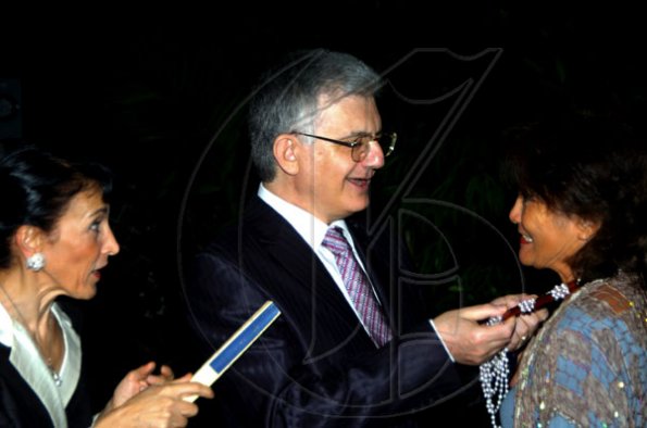 Winston Sill / Freelance Photographer
Ambassador Marco Mazzocchi Alemanni and wife Fiela (left) admire the pearls sported by Thalia Lyn.

Mazzocchi Alemanni host Europe Day Reception, held at Hyperion Avenue, Jacks Hill on Wednesday night May 12, 2010.