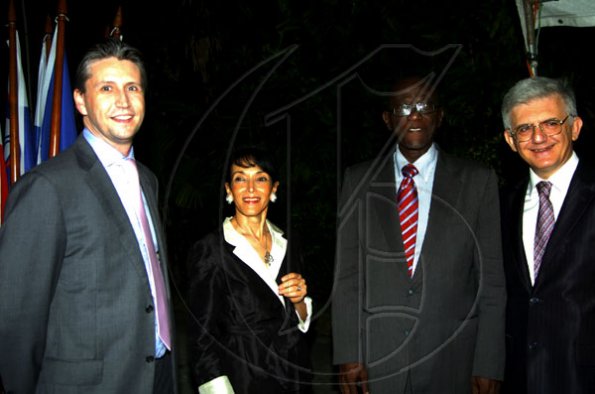 Winston Sill / Freelance Photographer
With National Security Minister Dwight Nelson (second right) in the house, there's no need to panic and Ambassador Marco Mazzocchi Alemanni (right), wife Fiela and Tom Millar don't seem worried.
 host Europe Day Reception, held at Hyperion Avenue, Jacks Hill on Wednesday night May 12, 2010.