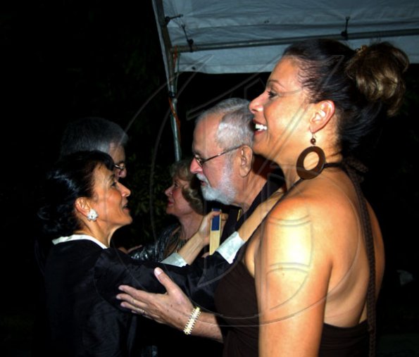 Winston Sill / Freelance Photographer
Fiela Mazzocchi Alemanni (left) greets Joseph A Matalon and wife Bernadette.

and Fiela Mazzocchi Alemanni host Europe Day Reception, held at Hyperion Avenue, Jacks Hill on Wednesday night May 12, 2010.