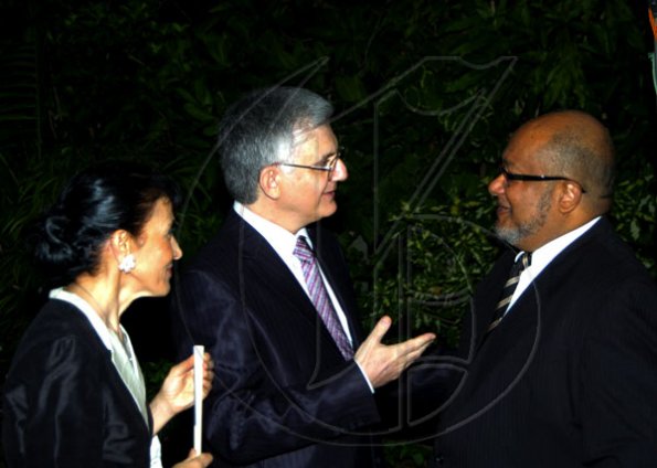 Winston Sill / Freelance Photographer
We catch Major Richard Reese (right) in animated convo with Ambassador Marco Mazzocchi Alemanni and wife Fiela.

 Mazzocchi Alemanni host Europe Day Reception, held at Hyperion Avenue, Jacks Hill on Wednesday night May 12, 2010.