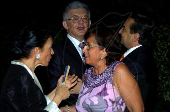 Winston Sill / Freelance Photographer
Ambassador Marco Mazzocchi Alemanni (second left) and wife Fiela (left) greet Chilean Ambassador Alfredo Garcia and wife Luz.

host Europe Day Reception, held at Hyperion Avenue, Jacks Hill on Wednesday night May 12, 2010.