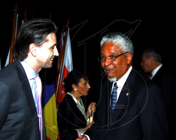 Winston Sill / Freelance Photographer
EU official Tom Millar (left) jokes with University of the West Indies Vice-Chancellor Professor E. Nigel Harris.

Ambassador Marco Mazzocchi Alemanni and Fiela Mazzocchi Alemanni host Europe Day Reception, held at Hyperion Avenue, Jacks Hill on Wednesday night May 12, 2010.