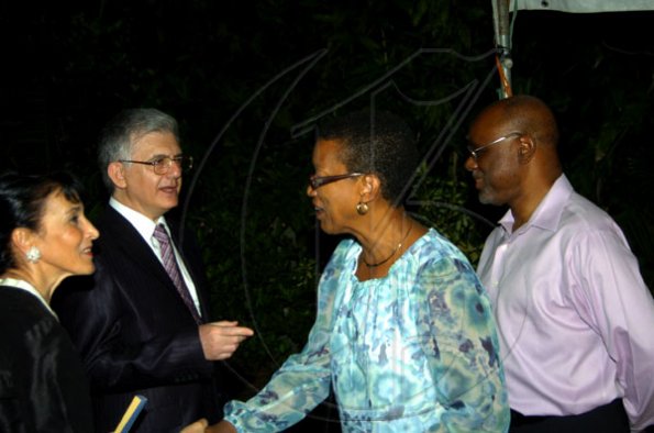 Winston Sill / Freelance Photographer
Head of the European Union delegation Ambassador Marco Mazzocchi Alemanni (second left) and wife Fiela (left) joke with Keva and Michael Hylton at the Europe Day reception, held at Hyperion Avenue, Jacks Hill on Wednesday night May 12, 2010.