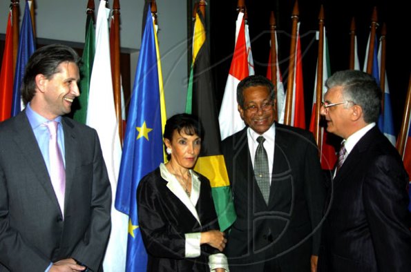 Winston Sill / Freelance Photographer
EU head Ambassador Marco Mazzocchi Alemanni (right), wife Fiela and Tom Millar (left) welcome Deputy Prime Minister Dr Ken Baugh to the Europe Day Reception, held at Hyperion Avenue, Jacks Hill on Wednesday night May 12, 2010.