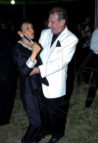 Winston Sill / Freelance Photographer
Charles Hanna cuts a rug (or the lawn in this case) with Fiela Mazzocchi Alemanni.

Ambassador Marco Mazzocchi Alemanni and Fiela Mazzocchi Alemanni host Europe Day Reception, held at Hyperion Avenue, Jacks Hill on Wednesday night May 12, 2010.