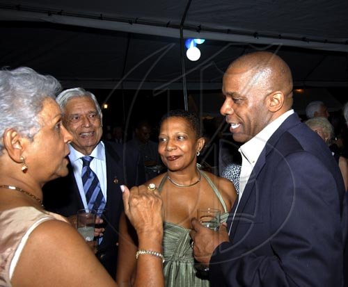 Winston Sill / Freelance Photographer
Ruby Martin (left) grabs the attention of Contractor General Greg Christie (right), his wife Jan and Pokar Chandiram.


Head of Delegation of the European Commission Marco and Fiela Mazzocchi Alemanni host Europe Day Reception, held at Hyperion Avenue, Jacks Hill on Wednesday May 13, 2009.