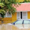 Norman Grindley /Chief Photographer
Flood waters cover this car at the Milk River Hotel and Spa in Clarendon yesterday. The area was flooded after heavy rains on Sunday.