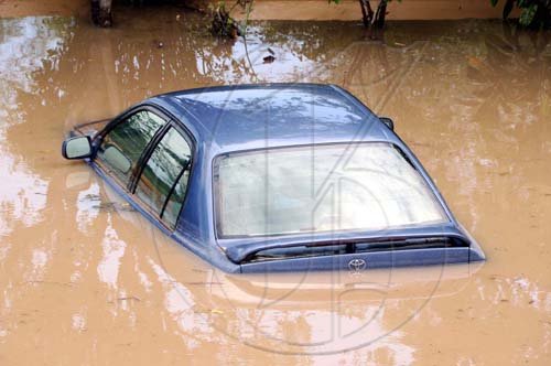 Norman Grindley/Chief Photographer
This partially submerged car was one of many vehicles rendered immobile by flood waters in Milk River, Clarendon, on Monday.

 Clarendon after heavy rain May, 25, 2009.