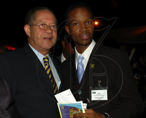 Colin Hamilton/freelance photographer
Darren Miller was caught having a word with the PM during the Opening Ceremony of the Inaugural Future Leaders Jamaican Diaspora Conference at the Mona Visitors Lodge on Tuesday August 4, 2009.