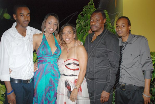 Janet Silvera Photo
 
Birthday girl, Janet Genus (centre) and her husband Adrian (second right) and her children Jondan (left), Adrienne and AJ (right).

************************************************************** at her 50th birthday party at Villa Sonate, Cardiff Hall, Runaway Bay in St. Ann last Saturday night.