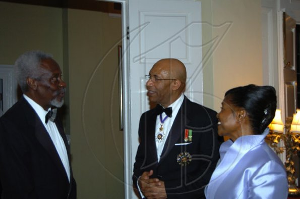 Winston Sill/Freelance Photographer
Former Prime Minister P.J. Patterson (left) makes his arrival and is greeted by Governor General Sir Patrick Allen and Lady Hall.

s dinner held in honour of the President of Tanzania, Jakaya Mrisho Kikwete at Kings House on Wednesday November 25, 2009.