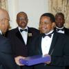 Winston Sill/Freelance Photographer
Governor General Sir Patrick Allen (left) presents Tanzanian President Jakaya Mrisho Kikwete with the Order of Excellence, Jamaica's highest award to a foreign head of state. Looking on is Salma Kikwete, the president's wife. In background from left are Major General Stewart Saunders and Acting Commissioner of Police Owen Ellington.

dinner held in honour of the President of Tanzania, Jakaya Mrisho Kikwete at Kings House on Wednesday November 25, 2009.