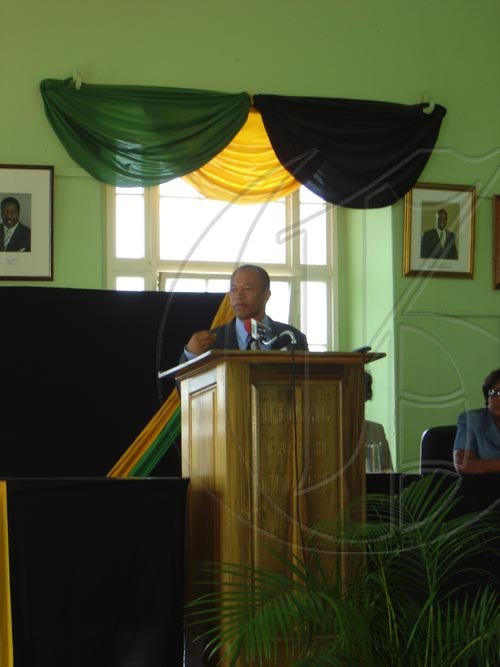 Dr. Patrick Harris, member of Parliament for North Trelawny, gives brief greetings to the Governor-General at the Parish Council Town Hall in Falmouth on Tuesday. The Parish Council was the first stop on the Governor-General's tour of Trelawny.