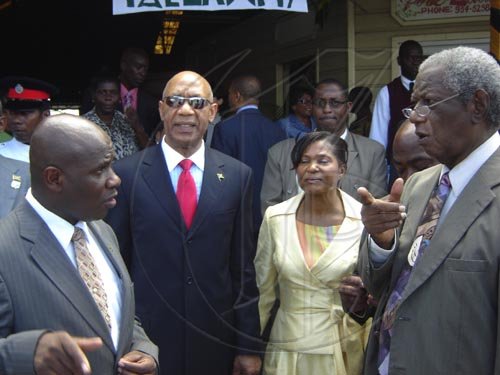 Standing outside the entrance to the Albert George Market and Shopping Centre, from left to right: Colin Gager, mayor of Falmouth; His Excellency the Most Honourable Sir Patrick Allen; Her Excellency the Most Honourable Lady Allen; Roylan Barrett, Custos Rotulorum of Trelawny.