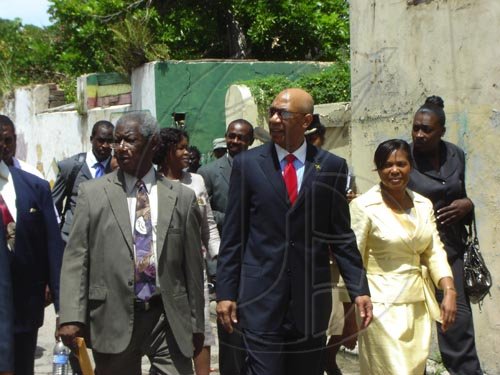 The Governor-General's entourage heads for the site of the Falmouth Port during the GG's tour of Trelawny on Tuesday. Leading the way, from left to right: Roylan Barrett, Custos Rotulorum of Trelawny; His Excellency the Most Honourable Sir Patrick Allen; Her Excellency the Most Honourable Lady Allen.