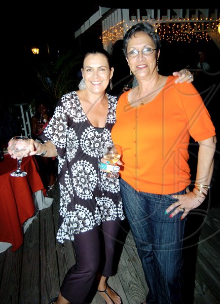 Winston Sill / Freelance Photographer
Cindy Breakspeare-Bent (left); and Sonja Sutherland-Dumetz strike a pretty pose at the party.

************************************************************************************************************************Guardsman Group Limited host Christmas Party, Held at their Head Office, Old Hope Road on Friday December 11, 2009. Here are Cindy Breakspeare-Bent (left); and Sonja Sutherland-Dumetz (right).