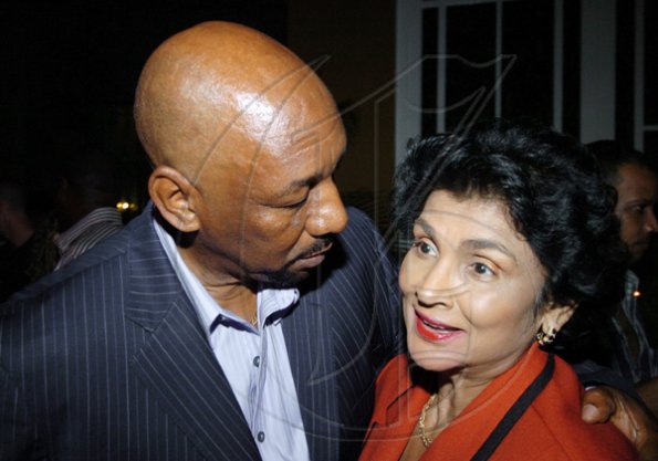 Winston Sill / Freelance Photographer
Health Minister Rudyard Spencer, seems to be tending to Guardsman's chief executive officer Valerie Juggan-Brown.

************************************************************* 
Guardsman Group Limited host Christmas Party, Held at their Head Office, Old Hope Road on Friday December 11, 2009. (right).
