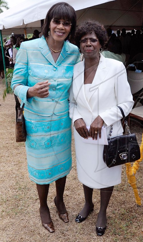 Rudolph Brown/Chief Photographer
Lorna Golding, (right) wife of Prime Minister Bruce Golding and Portia Simpson-Miller Opposition Leader at the Independence Day Ceremony at Kings House on Thursday, August 6-2009