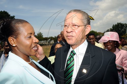 Rudolph Brown/Chief Photographer
Andrea Franis chat with Prime Minister Bruce Golding at the Independence Day Ceremony at Kings House on Thursday, August 6-2009