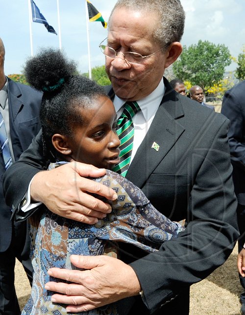 Rudolph Brown/Chief Photographer
Prime Minister Bruce Golding hugs Annadene Blake after the Independence Day Ceremony at Kings House on Thursday, August 6-2009