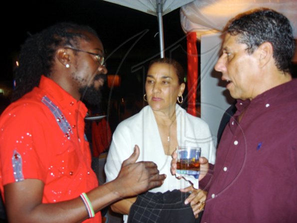 Contributed
The king of the dancehall, Beenie Man (left), chats with Lee-Ann and Johnny Gourzong spend time with the  Smirnoff crew.

************************************************************ at the Jamaica Jazz and Blues festival at Trelawny Multi Purpose Stadium on Thursday January 28.