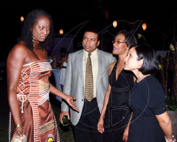 Colin Hamilton/Freelance Photogapher
Michael Samuel (second left) surrounded by beauties: former Olympics silver medalist, Grace Jackson (left), Cathy Rattry (second right), and Monique Todd.

********************************************************
JAAA Awards at Jamaica House on Saturday January 8, 2010.