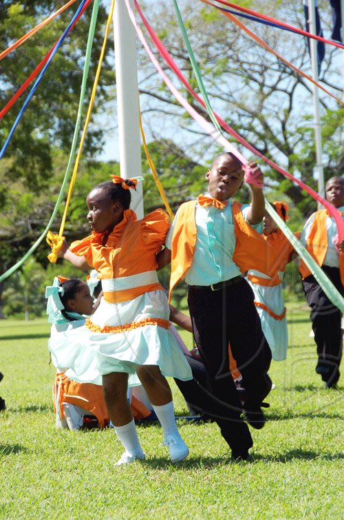 Ricardo Makyn/Staff Photographer.
Students of the Liberty Learning Centre perform on the Maypole at the Independence Day Ceremony at King's House on Friday.





 6.8.2010.