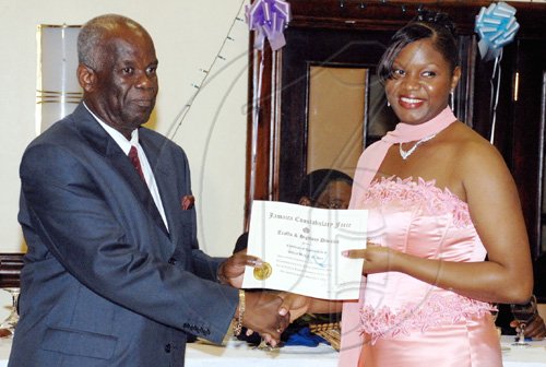 Colin Hamilton/freelance photographer
Corporal Debby-Ann Ayre receives an award from Dudley Bryan at the Jamaica Constabulary Force awards dinner.


******************************************************************** at the Pegasus Hotel on Saturday September 5, 2009.