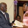 Colin Hamilton/freelance photographer
Cpl. Debby-Ann Ayre receives an award from Dudley Bryan during the Jamaica constabulary Force Awards Dinner at the Pegasus Hotel on Saturday September 5, 2009.