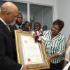 Ian Allen/Staff Photographer
Sir Patrick Allen left, Governor General along with Olilvia Grange centre, Minister of Youth, Sports and Culture presented with a Musgrave Gold Medal and citation to Wycliffe Bennett at an award ceremony at the University of the West Indies Hospital. Wycliffe Bennett right and his wife Dr. Hazel Bennett second right.Wycliffe Bennett who has been ailing for some time was also visited by  scores of admirers who attended the ceremony.