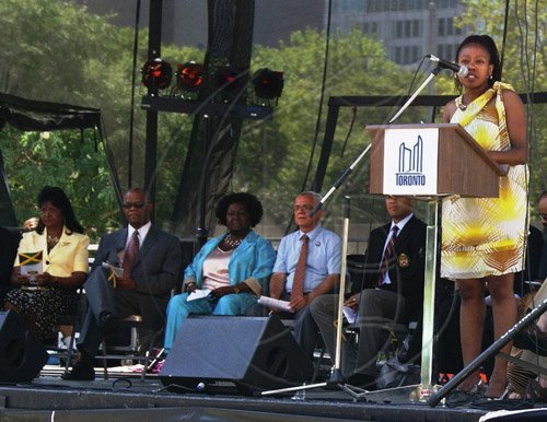 Contributed                                                                                                                                                                                                                                                          President of the Jamaican Canadian Association (JCA), Audrey Campbell, addresses the flag raising ceremony held on August 1 at Nathan Phillips Square, Toronto City Hall, to commemorate Jamaica’s Independence.  Seated (from left) are: Mrs. Lola Ramocan; Jamaica’s Consul General to Toronto, George Ramocan; Ontario’s Fairness Commissioner, Jean Augustine; Deputy Mayor of Toronto, Joe Pantalone; and Deputy Chief of Toronto Police Service, Peter Sloly.