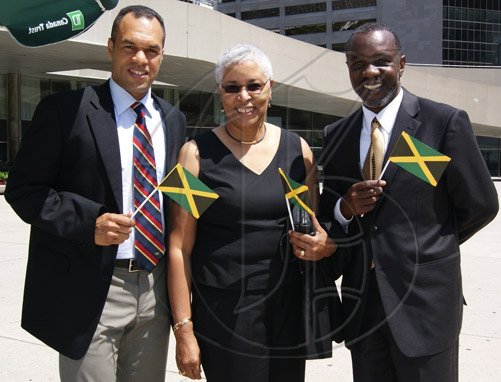 Contributed                                                                                                                                                                                                                                                          Deputy Chief of Toronto Police Service, Peter Sloly (left); President of the Project for the Advancement of Childhood Education (PACE) Canada, Mary Anne Chambers; and Consul at the Jamaican Consulate General in Toronto, Nigel Smith, proudly display miniature Jamaican flags at a flag raising ceremony held on August 1 at Nathan Phillips Square, Toronto City Hall, to commemorate Jamaica’s Independence.