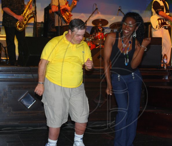 Janet Silvera Photo
 
A guest of the RIU Montego Bay hotel (left) and an entertainment coordinator at the resort dancing during Joe Roy Jackson's powerful performance at the Air Jamaica Jazz and Blues 'Prelude' concert on Tuesday night.