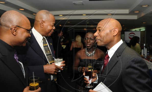 Winston Sill / Freelance Photographer
Jamaica Exporters Association (JEA) Awards Banquet, held at the Wyndham Hotel on Wednesday night  June 29, 2011. Here are Dr. Andre Gordon (left); Trevor Murray (second left); Brenda Leon (second right); and Dr. Gene Leon (right).