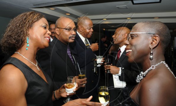 Winston Sill / Freelance Photographer
Jamaica Exporters Association (JEA) Awards Banquet, held at the Wyndham Hotel  on Wednesday night June 29, 2011. Here are Dianne Gordon (left); Dr. Andre Gordon (second left); Trevor Murray (third left); Dr. Gene Leon (second right); and Brenda Leon (right).
