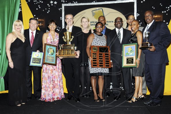 Winston Sill / Freelance Photographer
Jamaica Exporters Association (JEA) Awards Banquet, held at the Wyndham Hotel  on Wednesday night June 29, 2011. Here Vitus Evans (fourth right), President, JEA; and Allan Barnes (fourth left) pose with members of Red Stripe team.