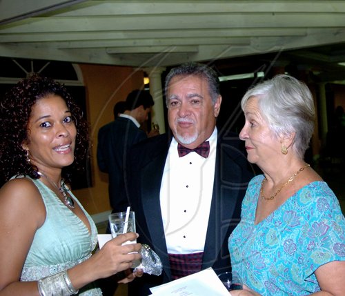 Winston Sill / Freelance Photographer
Jamaicans For Justice (JFJ) in association with Knutsford Court Hotel presents their Gala Dinner, Art and Collectibles Auction, held at Knutsford Court Hotel, Ruthven Road on Friday night June 4, 2010. Here are -------?? Chen (left); Errol Zaidie (centre); and Ingrid Zaidie (right).