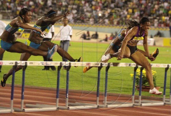 Anthony Minott/Freelance Photographer
USA's Gennie Powell (right) powers to victory in 12.72 seconds in the women's 100m hurdles race during the Jamaica National International Invitational athletics meet at the National Stadium, Kingston, on Saturday, May 1, 2010.