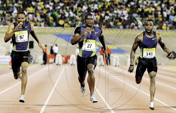 Ian Allen/Photographer
Jamaica's Nesta Carter (centre) wins the men's 100 metres, beating off challenges from the United States pair of Darvis Patton (left)and Trinidad and Tobago's Richard Thompson, at the Jamaica International Invitational track meet at the National Stadium.